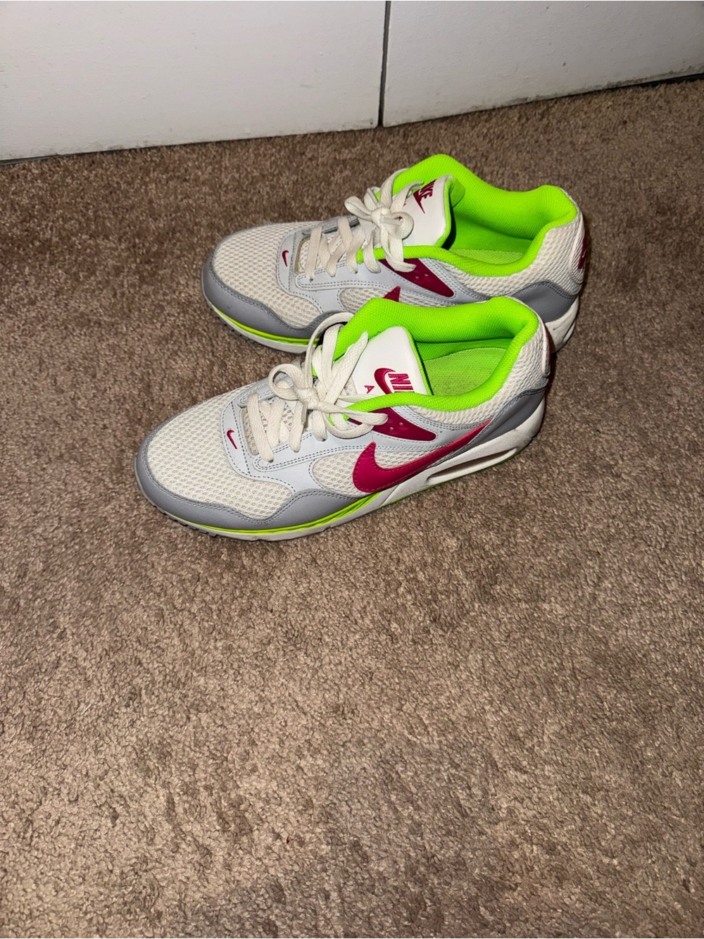 Nike Kids White Sneakers with Neon Green Lining and Pink Swoosh